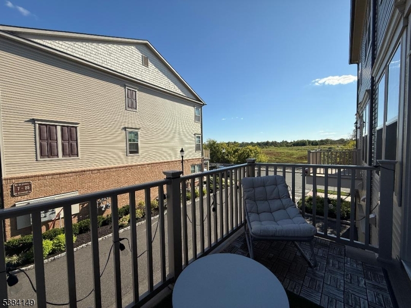 13 Sternadori Road Somerville, NJ 08876 - Photo 17 of 18 a view of a roof deck with couches and wooden floor