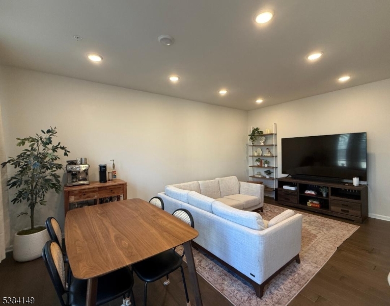 13 Sternadori Road Somerville, NJ 08876 - Photo 3 of 18 a living room with furniture and a flat screen tv