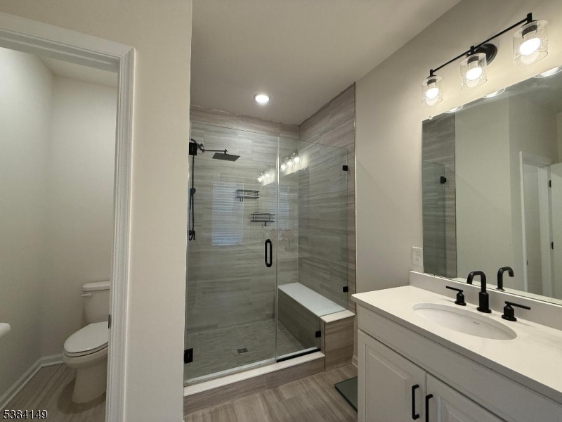 13 Sternadori Road Somerville, NJ 08876 - Photo 7 of 18 a bathroom with a shower sink mirror and toilet