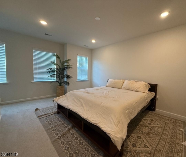 13 Sternadori Road Somerville, NJ 08876 - Photo 8 of 18 a bed sitting in a spacious bedroom next to a window
