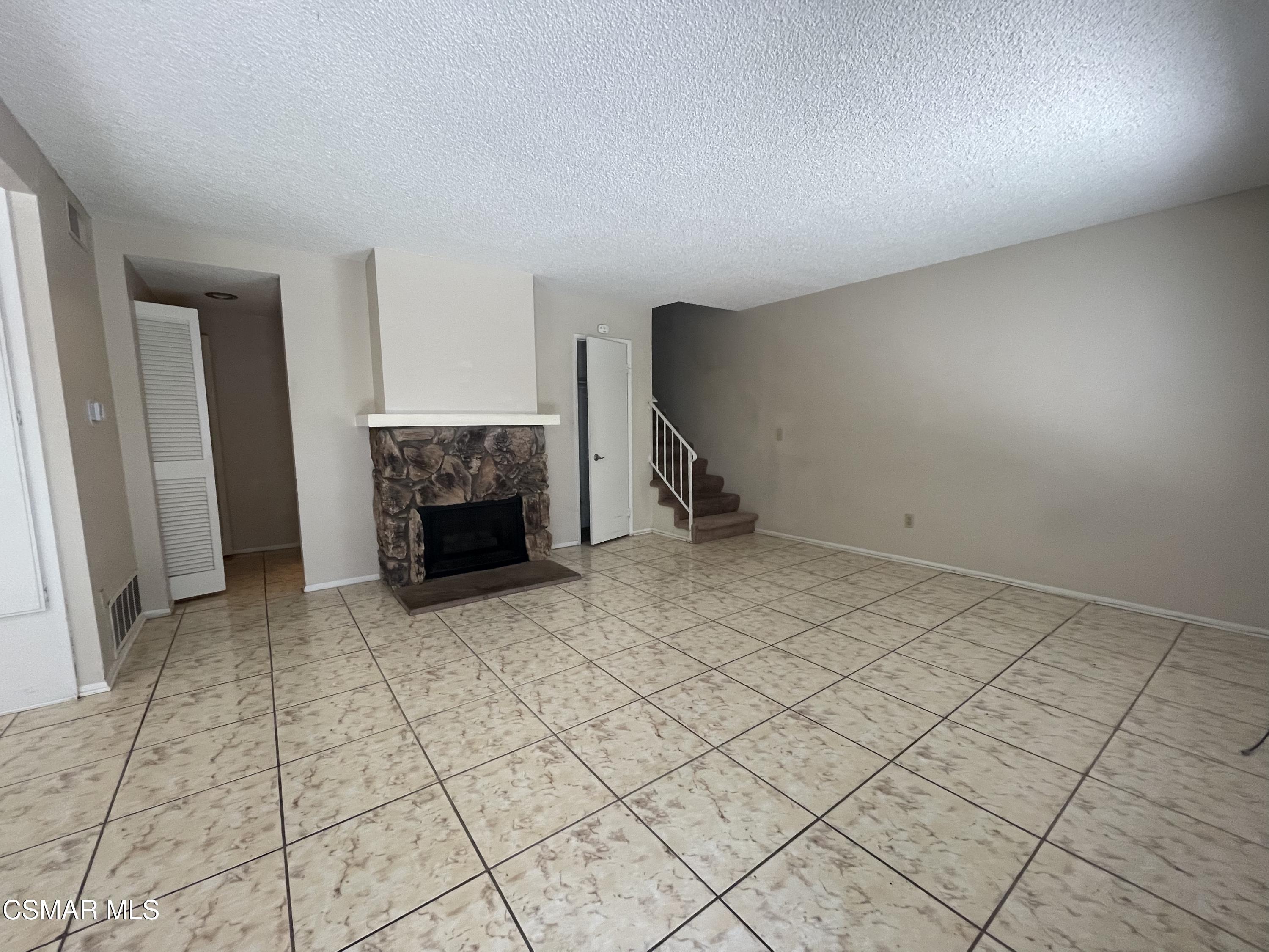 517 Spring Road, Unit 11 Moorpark, CA 93021 - Photo 4 of 4 a view of an empty room with a fireplace