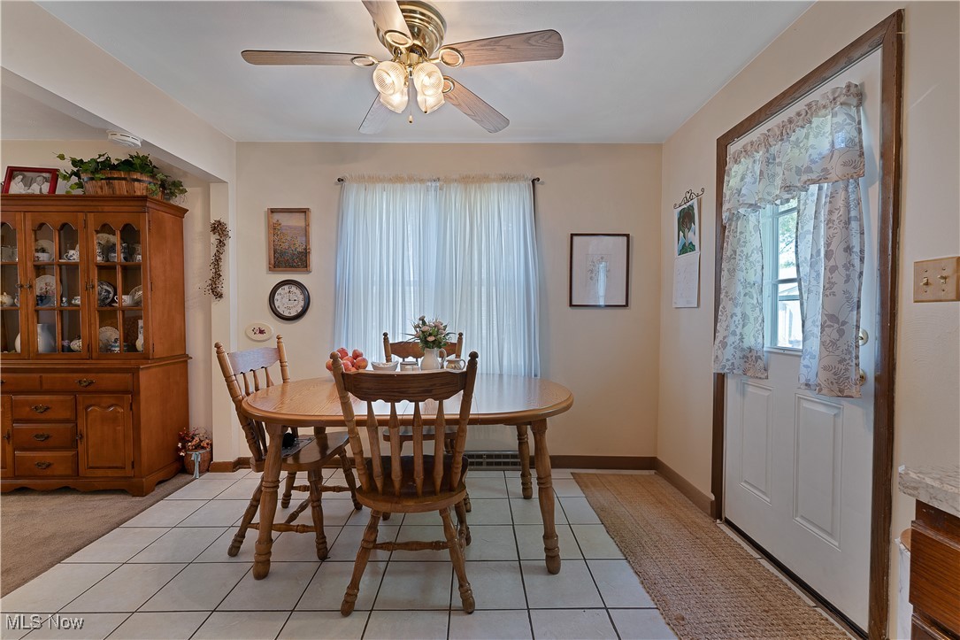 9925 Struthers Road New Middletown, OH 44442 - Photo 7 of 12 Dining area with ceiling fan and light tile patterned floors