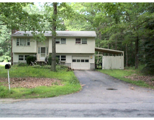 39 Rich Road Thompson, CT 06255 - Photo 1 of 1 a view of a house with a yard plants and large tree