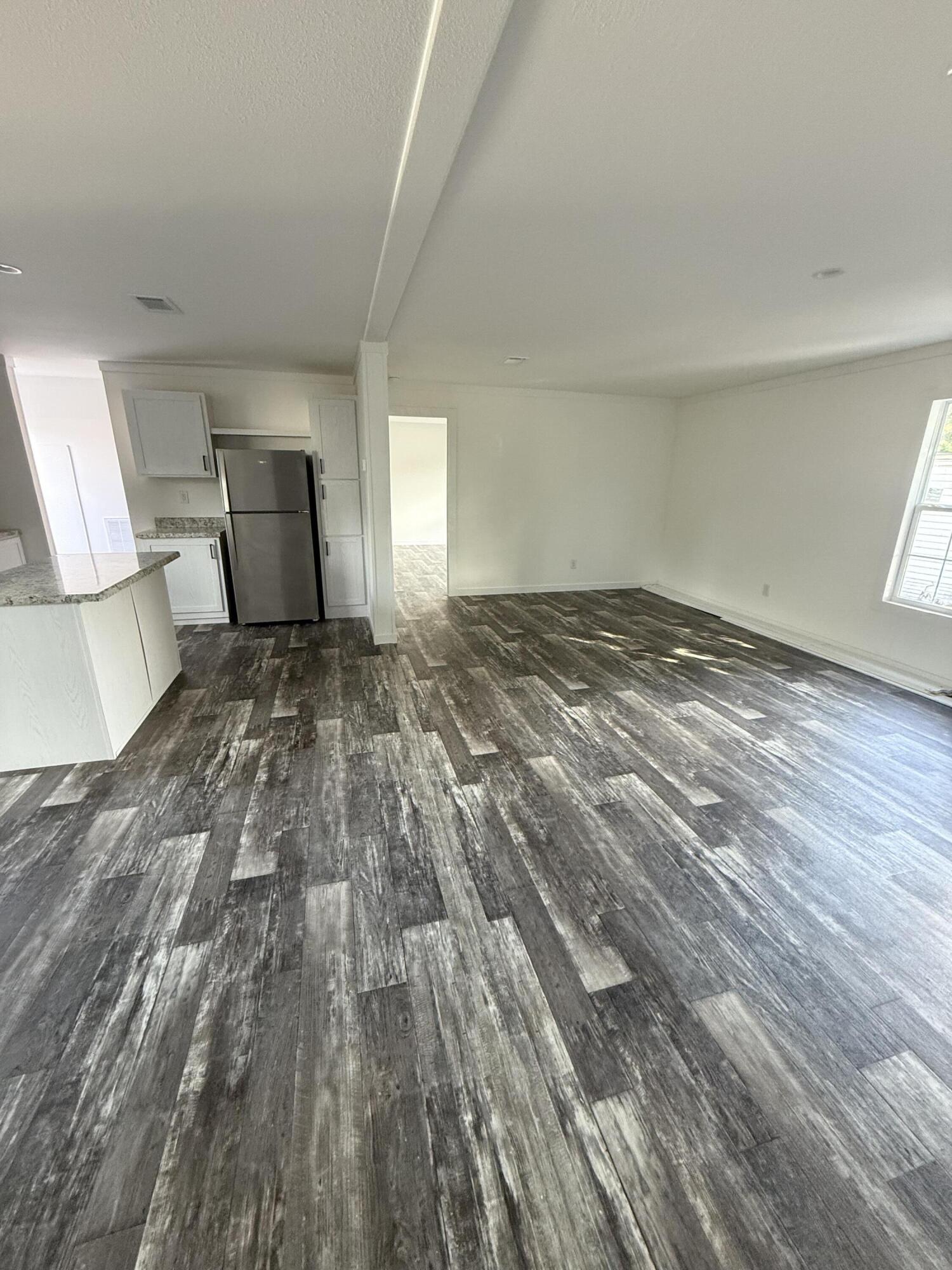 22963 Seaspray Place Boca Raton, FL 33428 - Photo 4 of 10 a view of a bedroom with wooden floor and bedroom
