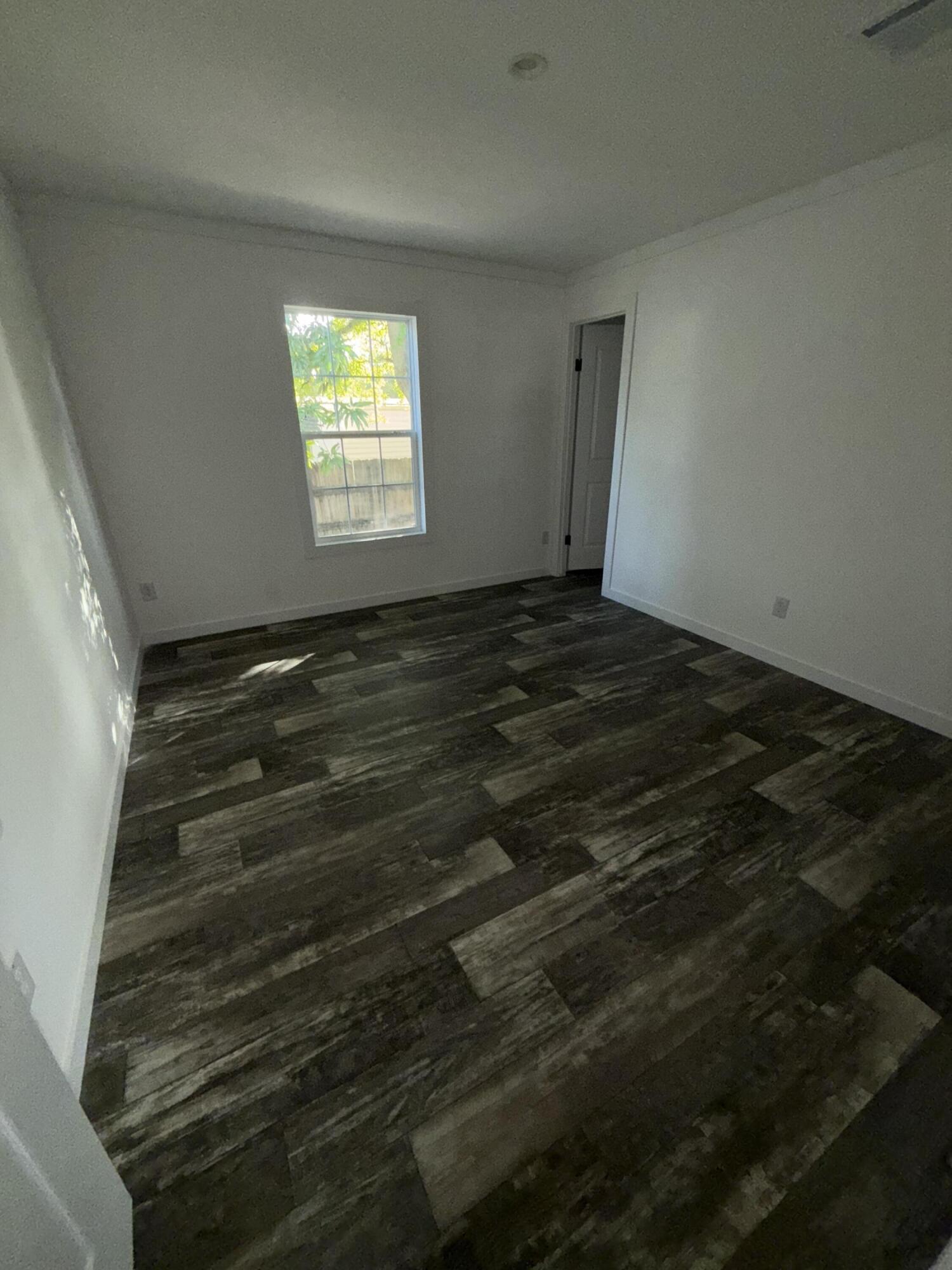 22963 Seaspray Place Boca Raton, FL 33428 - Photo 7 of 10 a view of an empty room and window