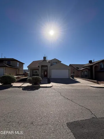 a view of a car parked in front of a house