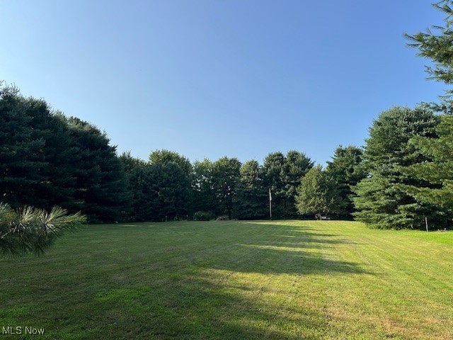 5795 Merwin Chase Road Brookfield, OH 44403 - Photo 35 of 39 View of green lawn with a view of trees