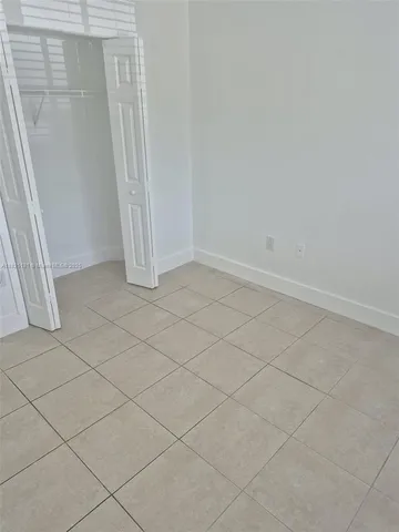 an empty room with a fireplace