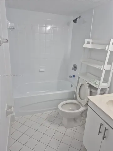 a bathroom with a sink a toilet and a bathtub