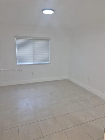 an empty room with a empty space and window