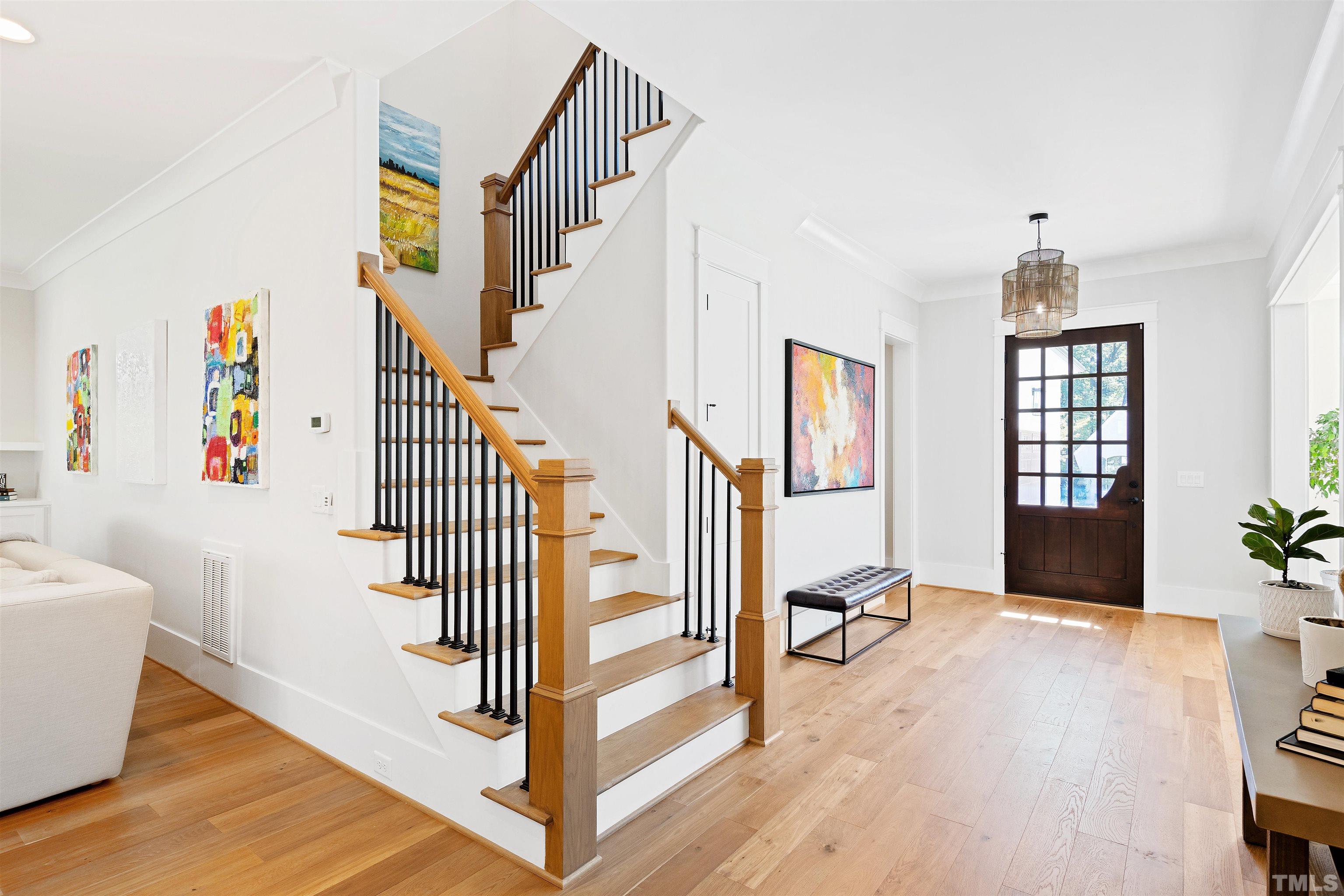 3512 Catalano Drive Raleigh, NC 27607 - Photo 14 of 64 a view of entryway and hall with wooden floor