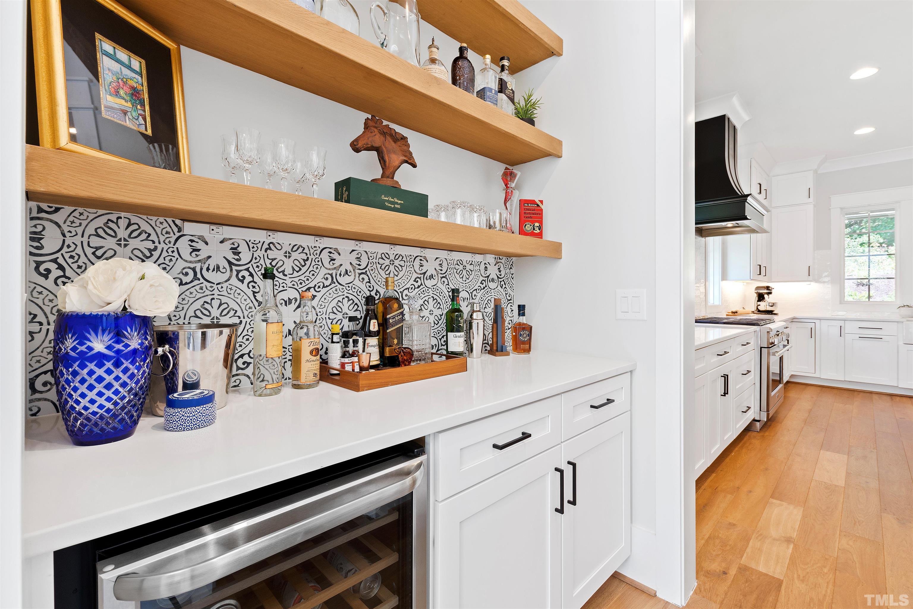 3512 Catalano Drive Raleigh, NC 27607 - Photo 25 of 64 a kitchen with stainless steel appliances cabinets and a wooden floor