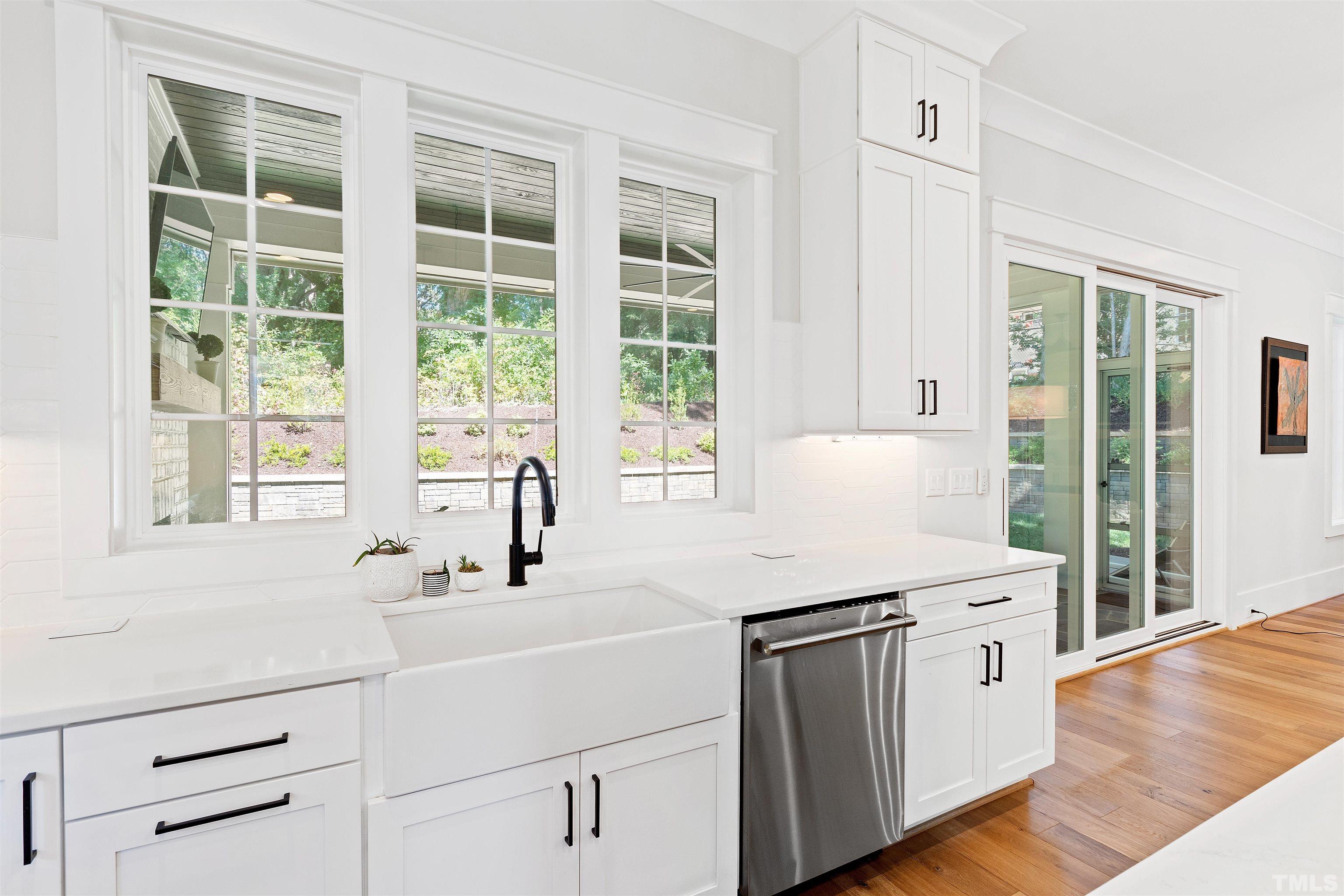 3512 Catalano Drive Raleigh, NC 27607 - Photo 3 of 64 a kitchen with a sink stove and cabinets