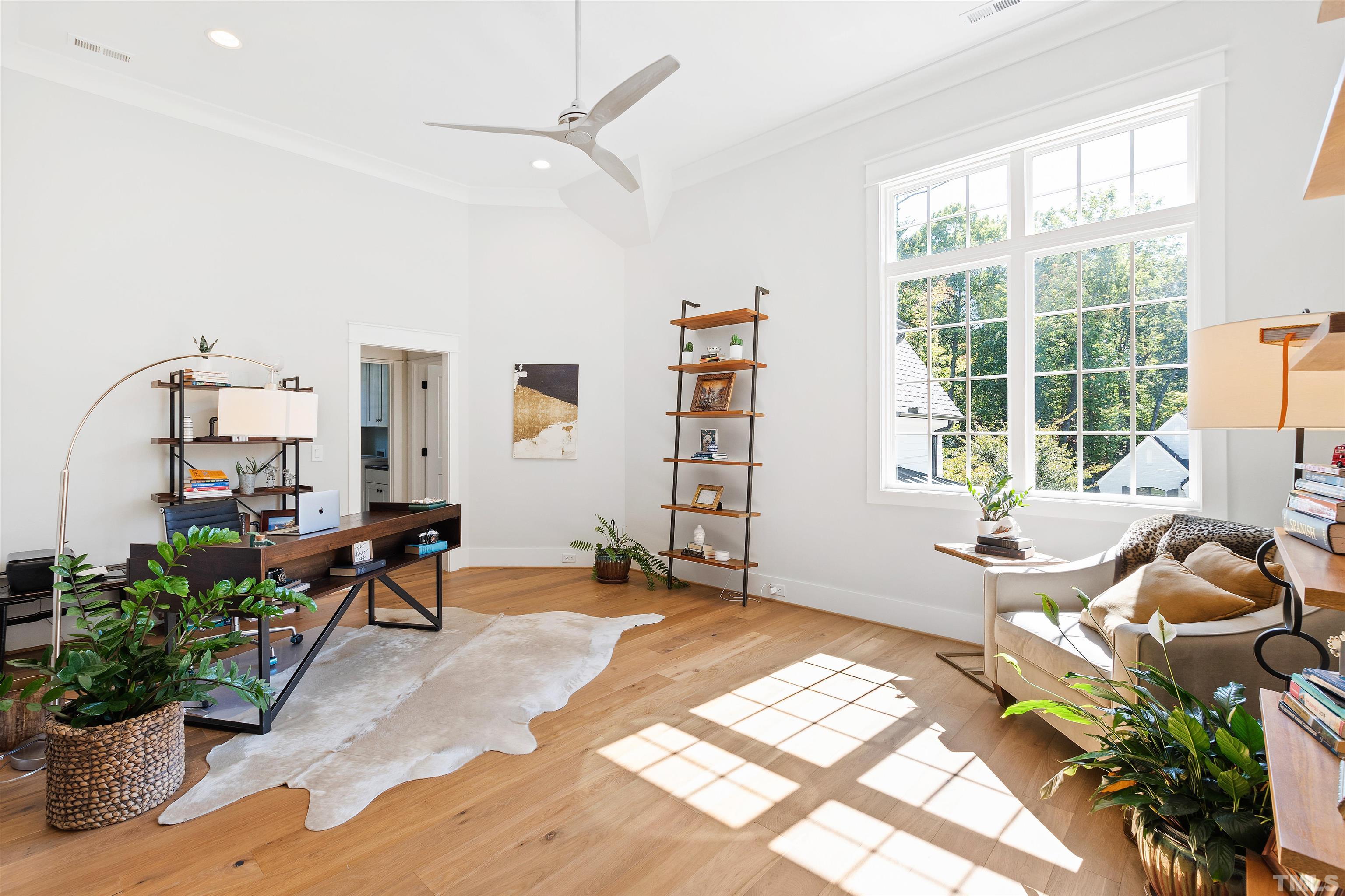 3512 Catalano Drive Raleigh, NC 27607 - Photo 32 of 64 a living room with furniture and a potted plant