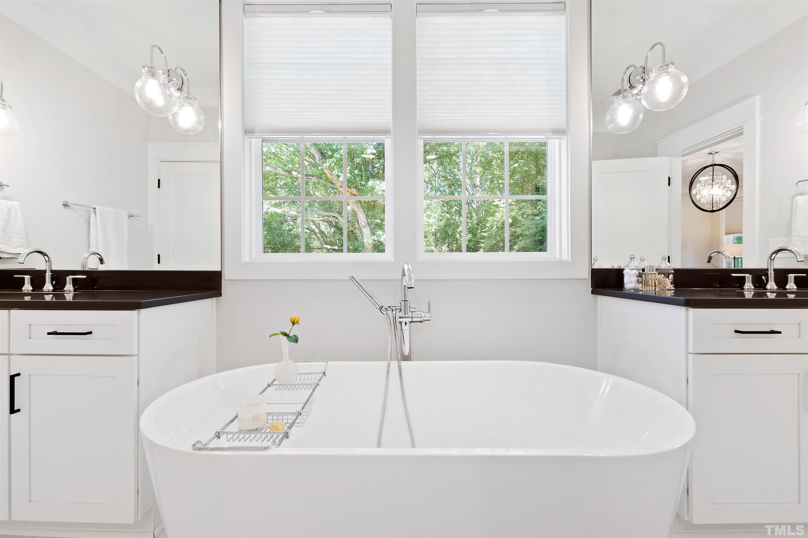 3512 Catalano Drive Raleigh, NC 27607 - Photo 37 of 64 a white bath tub sitting in a bathroom