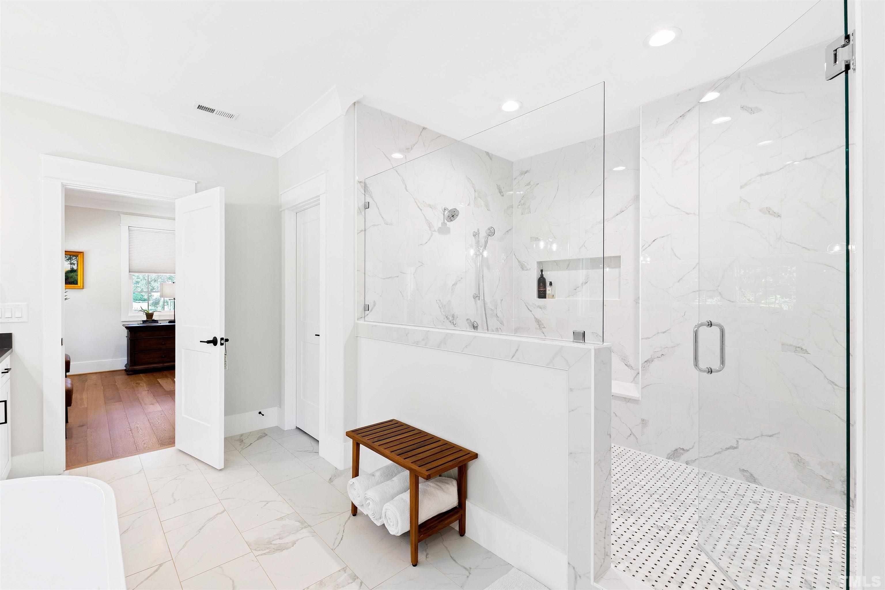 3512 Catalano Drive Raleigh, NC 27607 - Photo 39 of 64 a bathroom with a bathtub and a shower
