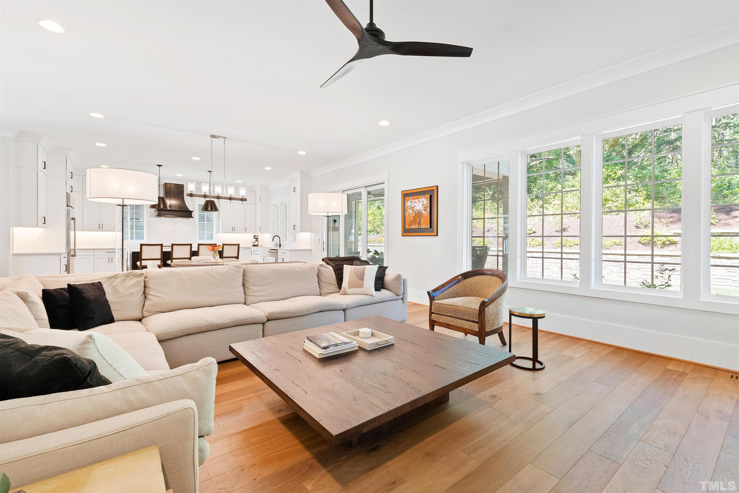 3512 Catalano Drive Raleigh, NC 27607 - Photo 4 of 64 a living room with furniture wooden floor and a large window