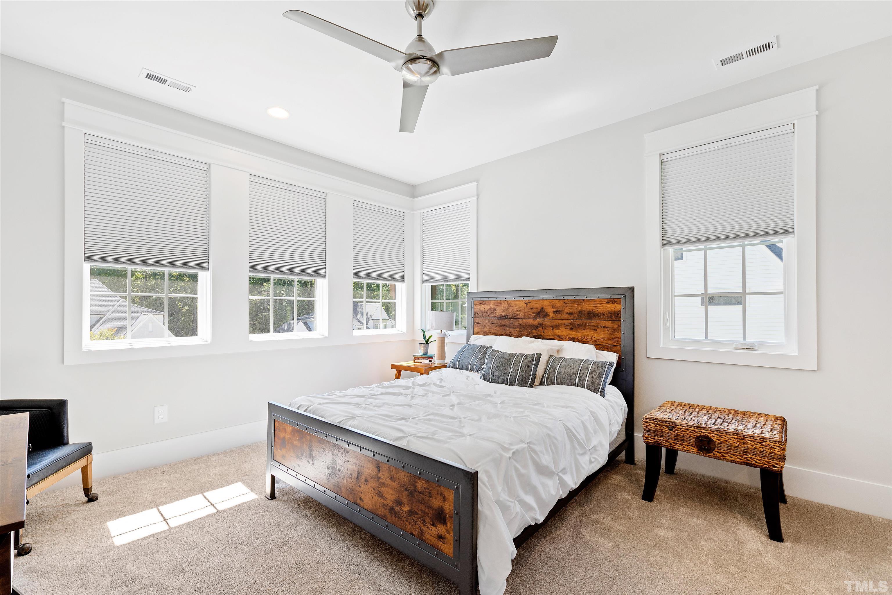 3512 Catalano Drive Raleigh, NC 27607 - Photo 45 of 64 a spacious bedroom with a bed and a window