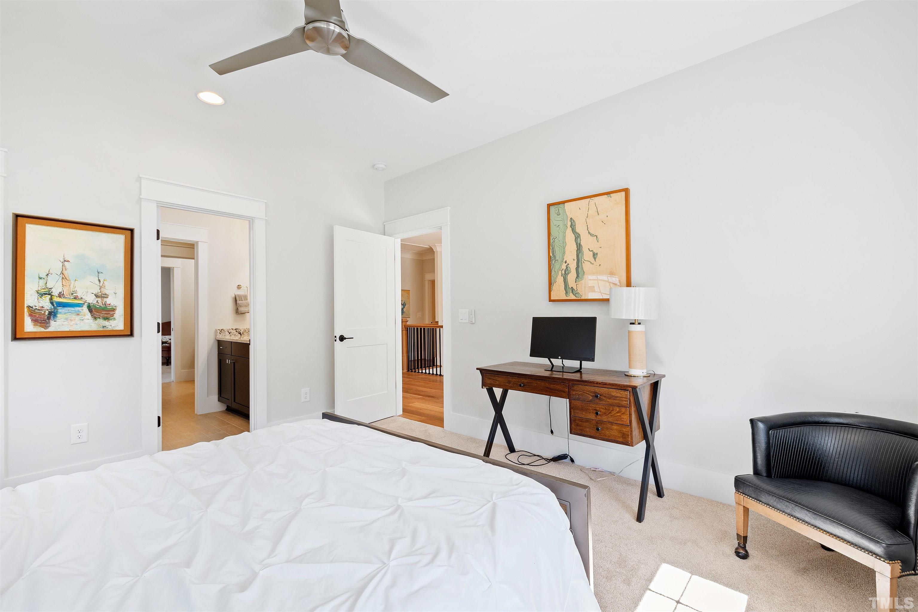 3512 Catalano Drive Raleigh, NC 27607 - Photo 46 of 64 a bedroom with a bed and a flat screen tv