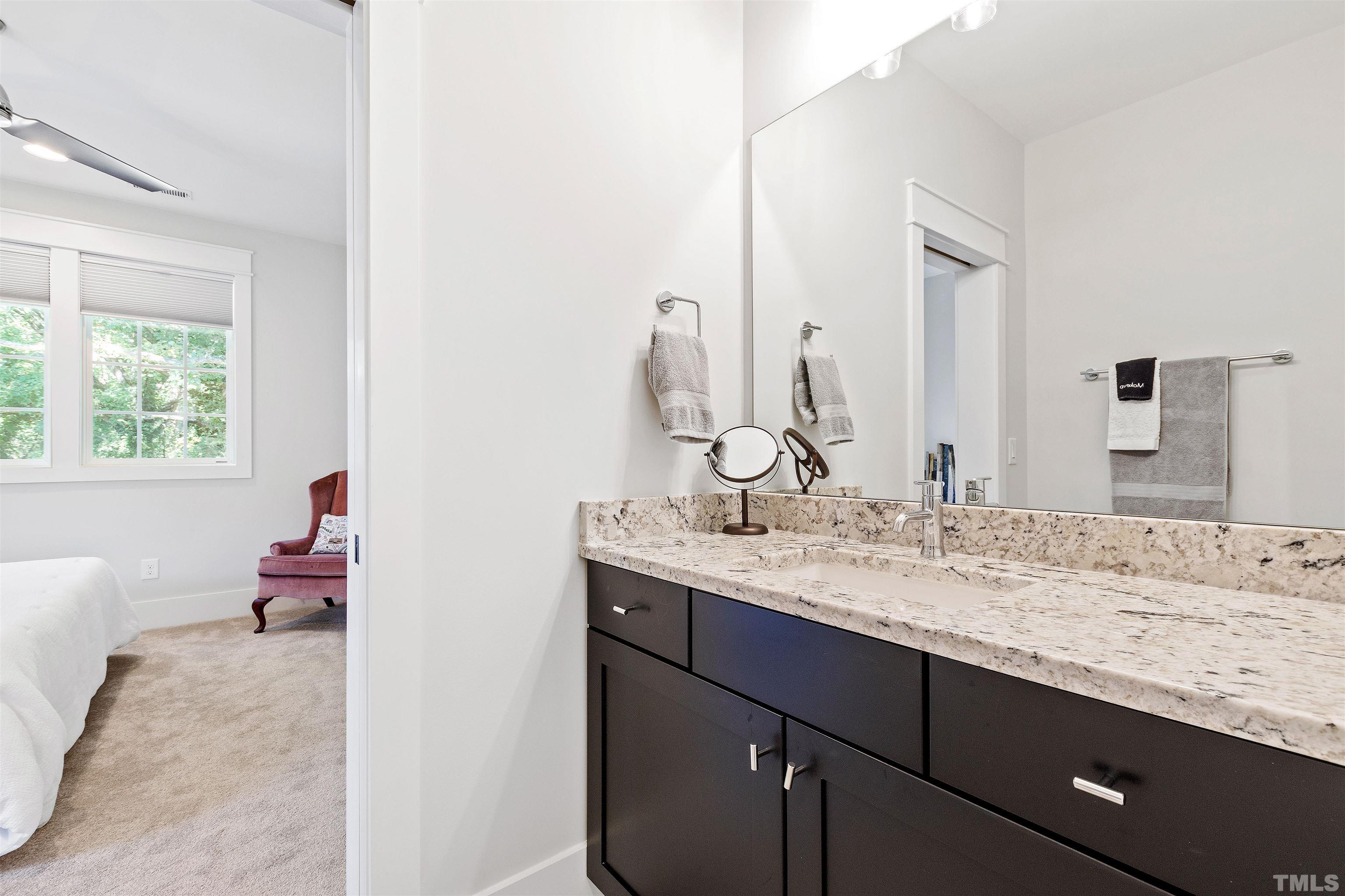 3512 Catalano Drive Raleigh, NC 27607 - Photo 49 of 64 a bathroom with a sink and a mirror