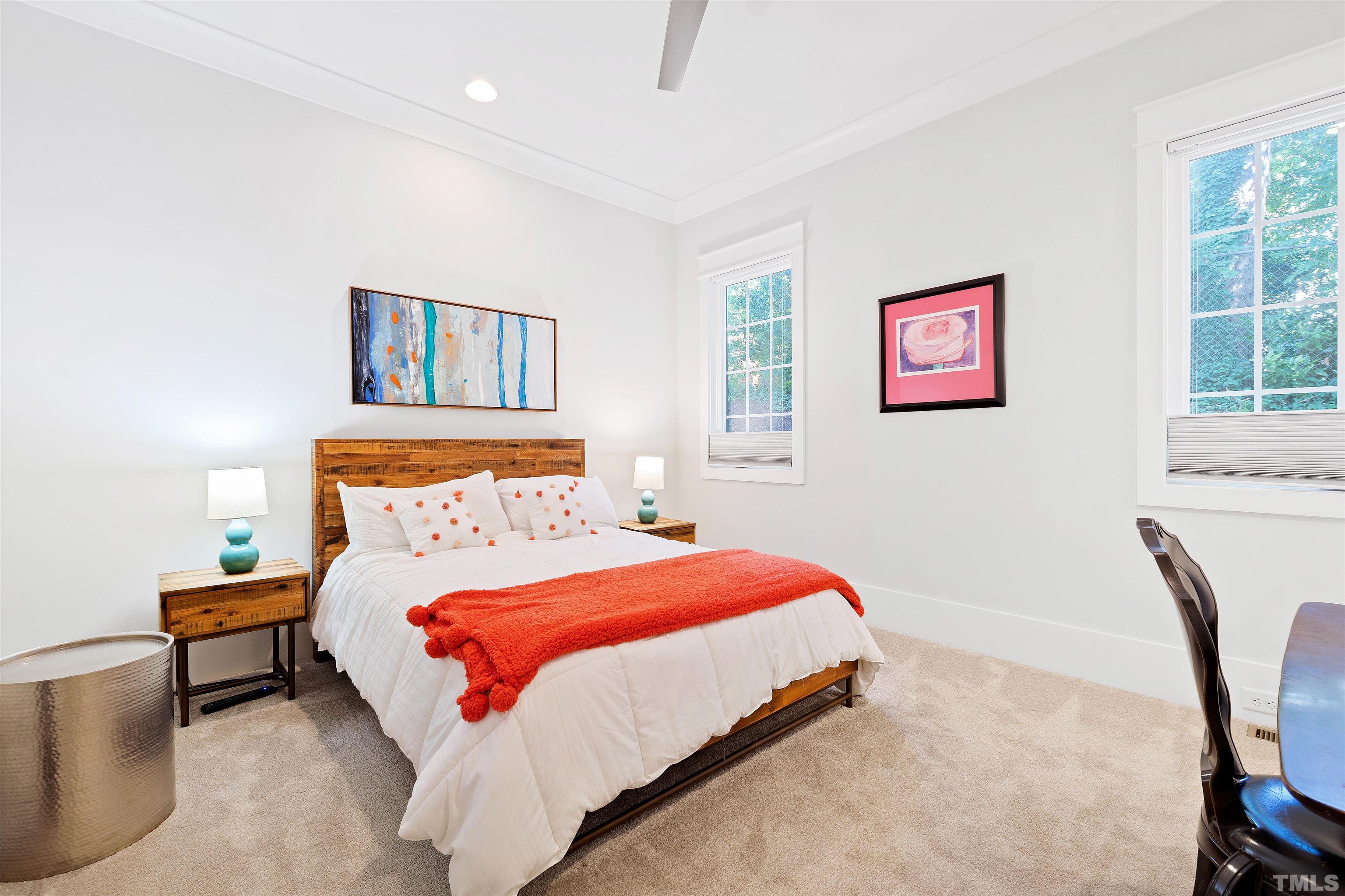 3512 Catalano Drive Raleigh, NC 27607 - Photo 50 of 64 a bedroom with a bed wall painting and a window