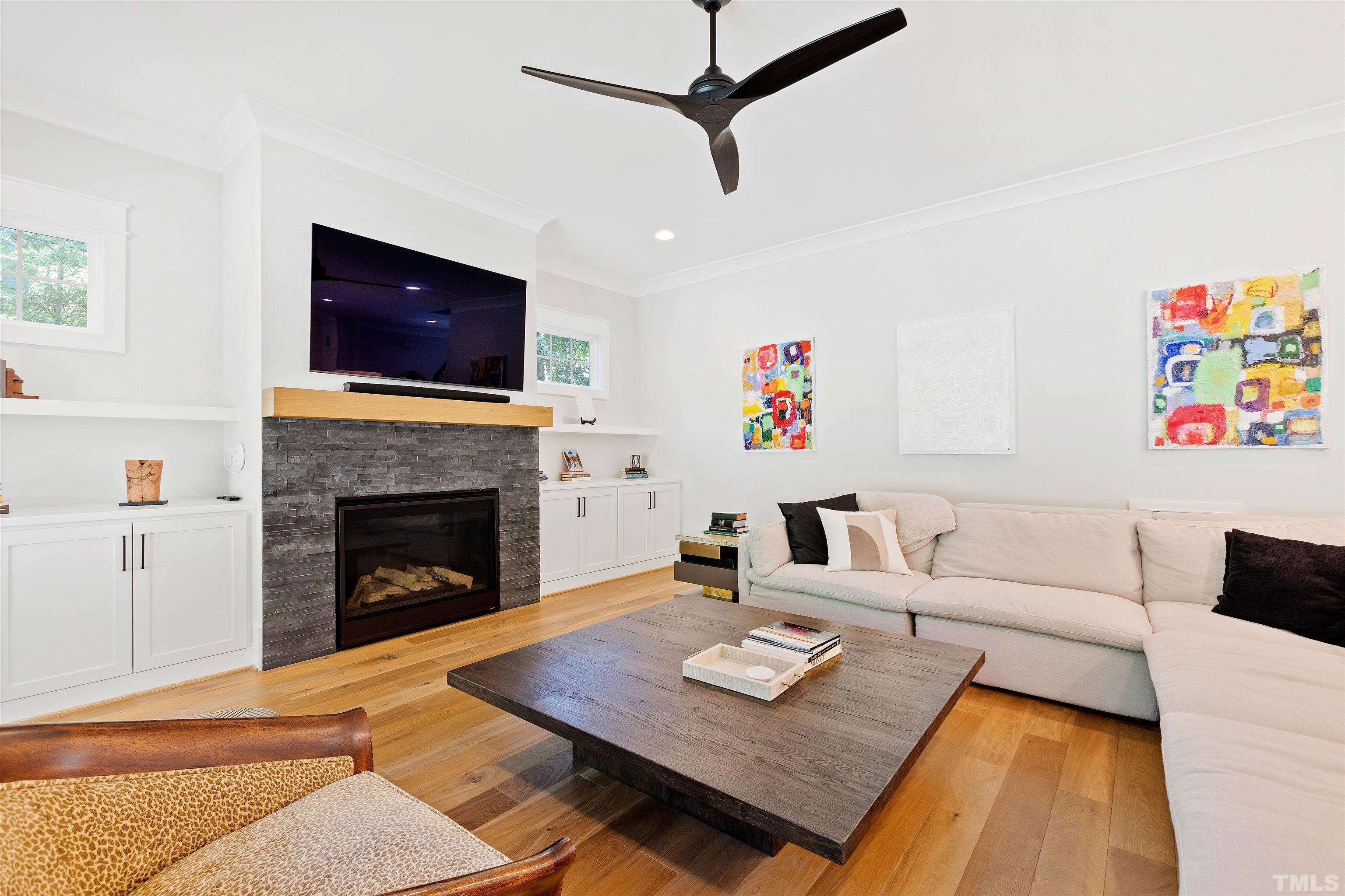 3512 Catalano Drive Raleigh, NC 27607 - Photo 5 of 64 a living room with furniture and a fireplace