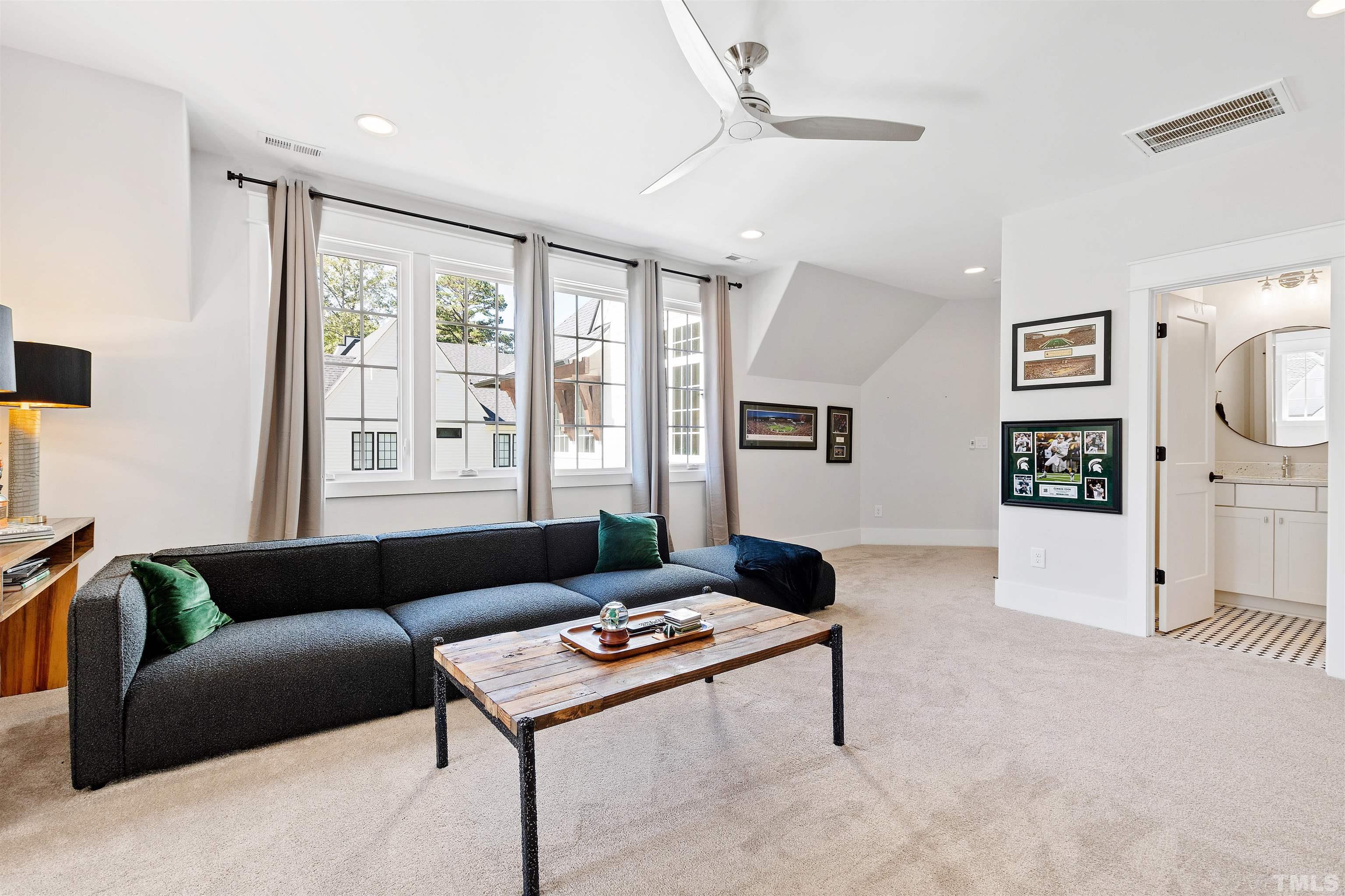 3512 Catalano Drive Raleigh, NC 27607 - Photo 54 of 64 a living room with furniture and a flat screen tv