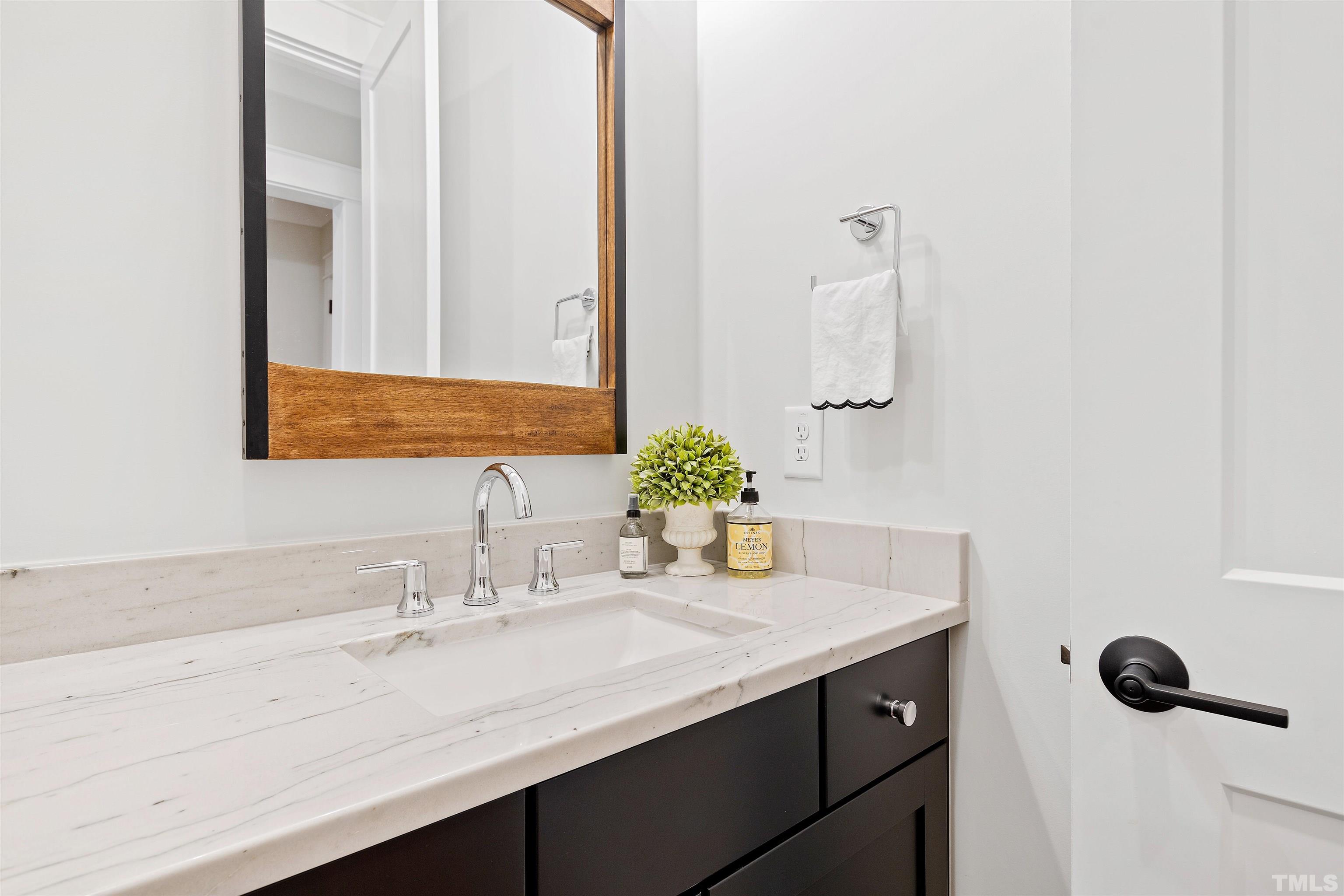 3512 Catalano Drive Raleigh, NC 27607 - Photo 57 of 64 a bathroom with a sink and a mirror