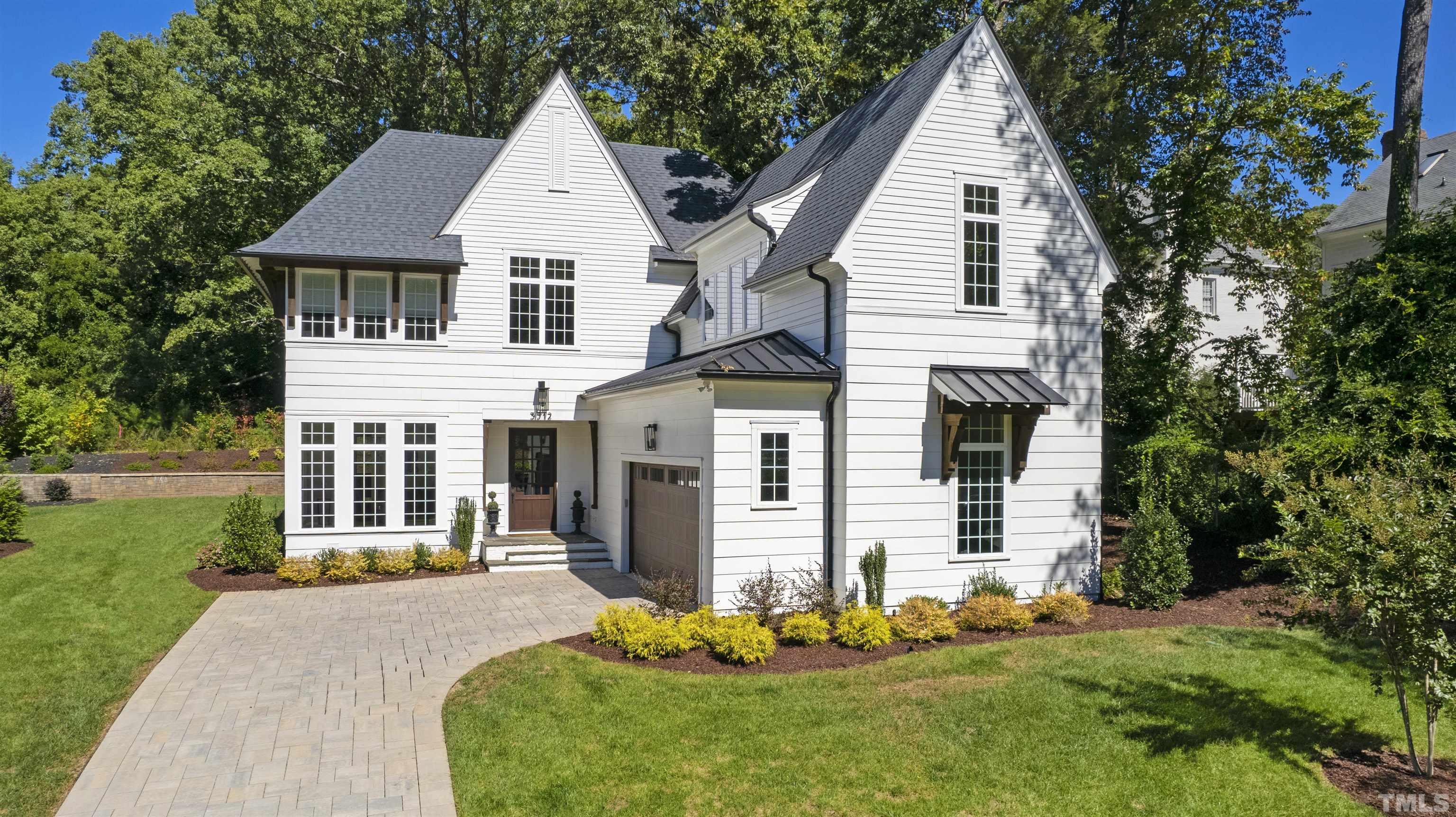 3512 Catalano Drive Raleigh, NC 27607 - Photo 62 of 64 a front view of a house with a yard and garage