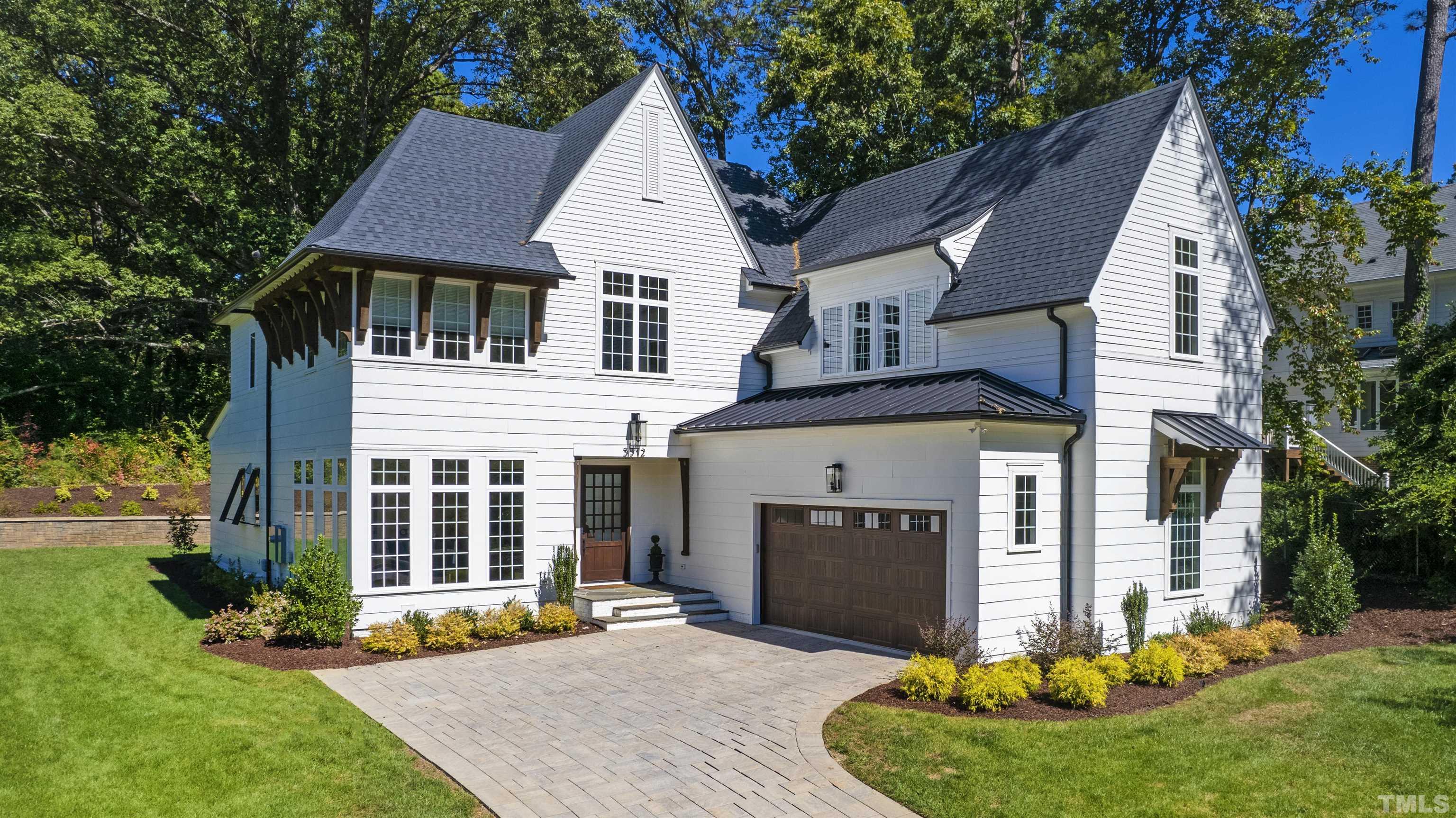 3512 Catalano Drive Raleigh, NC 27607 - Photo 64 of 64 a front view of a house with a yard and garage