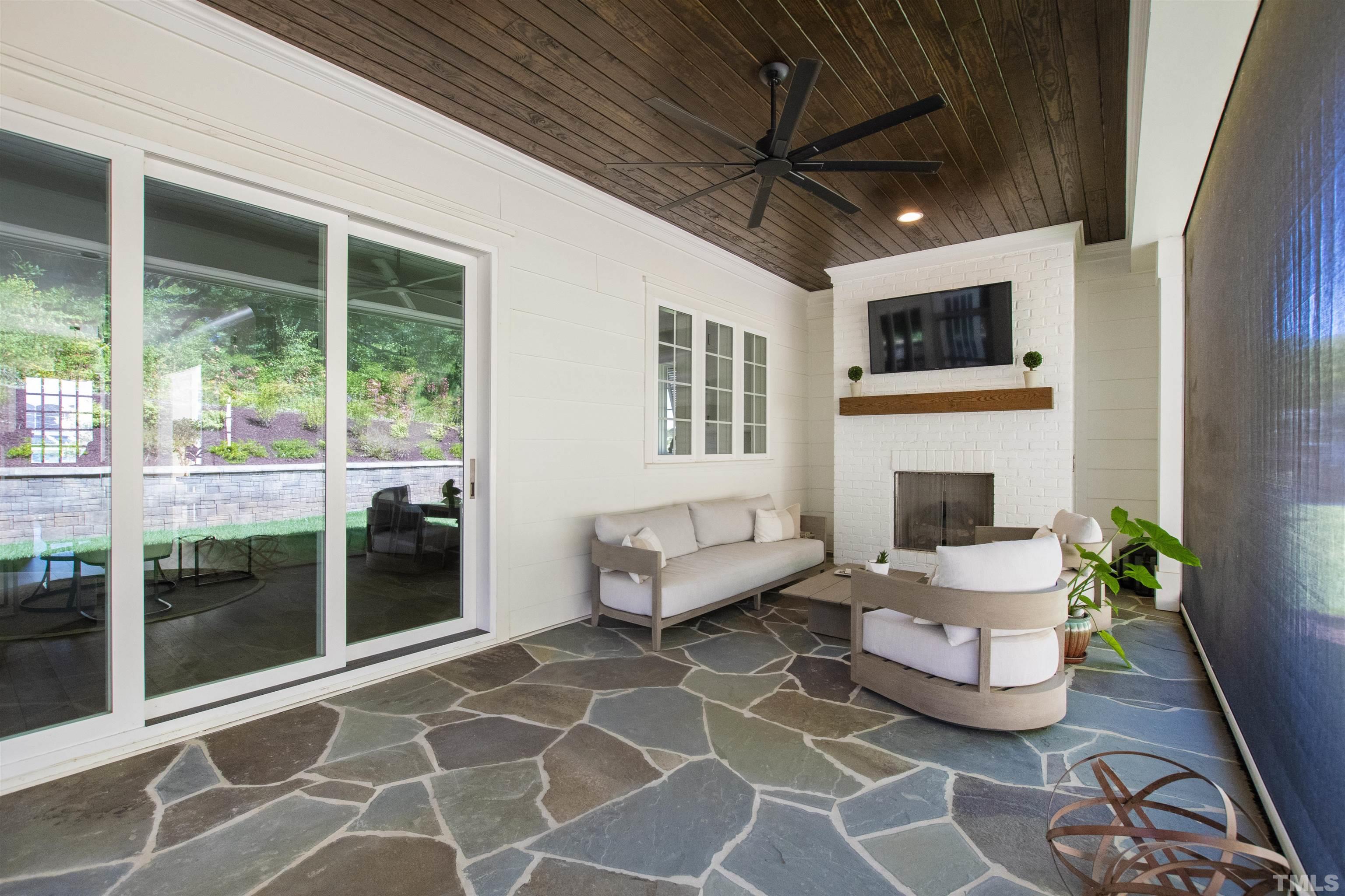 3512 Catalano Drive Raleigh, NC 27607 - Photo 7 of 64 a outdoor space with a couch and a fireplace