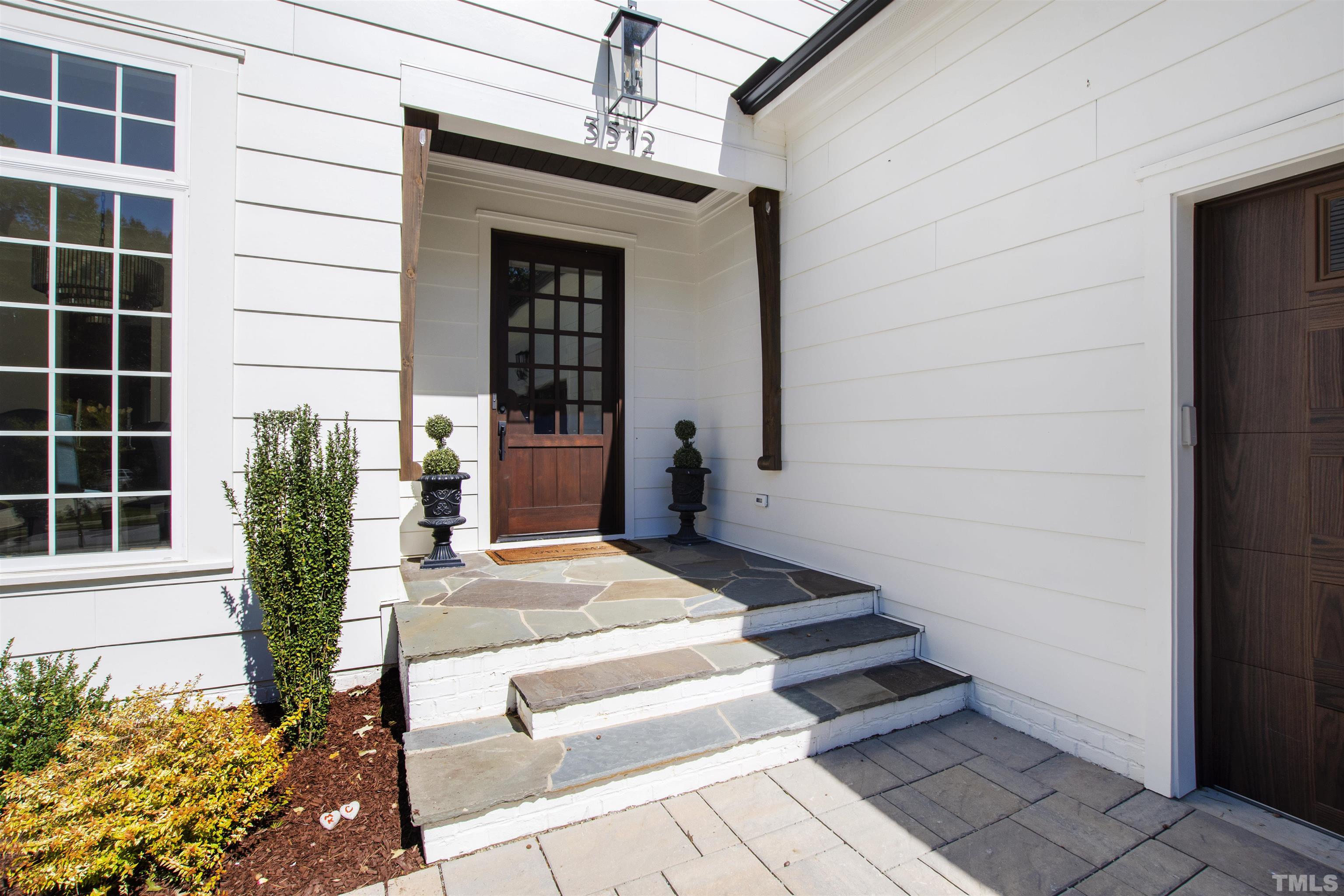 3512 Catalano Drive Raleigh, NC 27607 - Photo 8 of 64 a front view of a house with a potted plant
