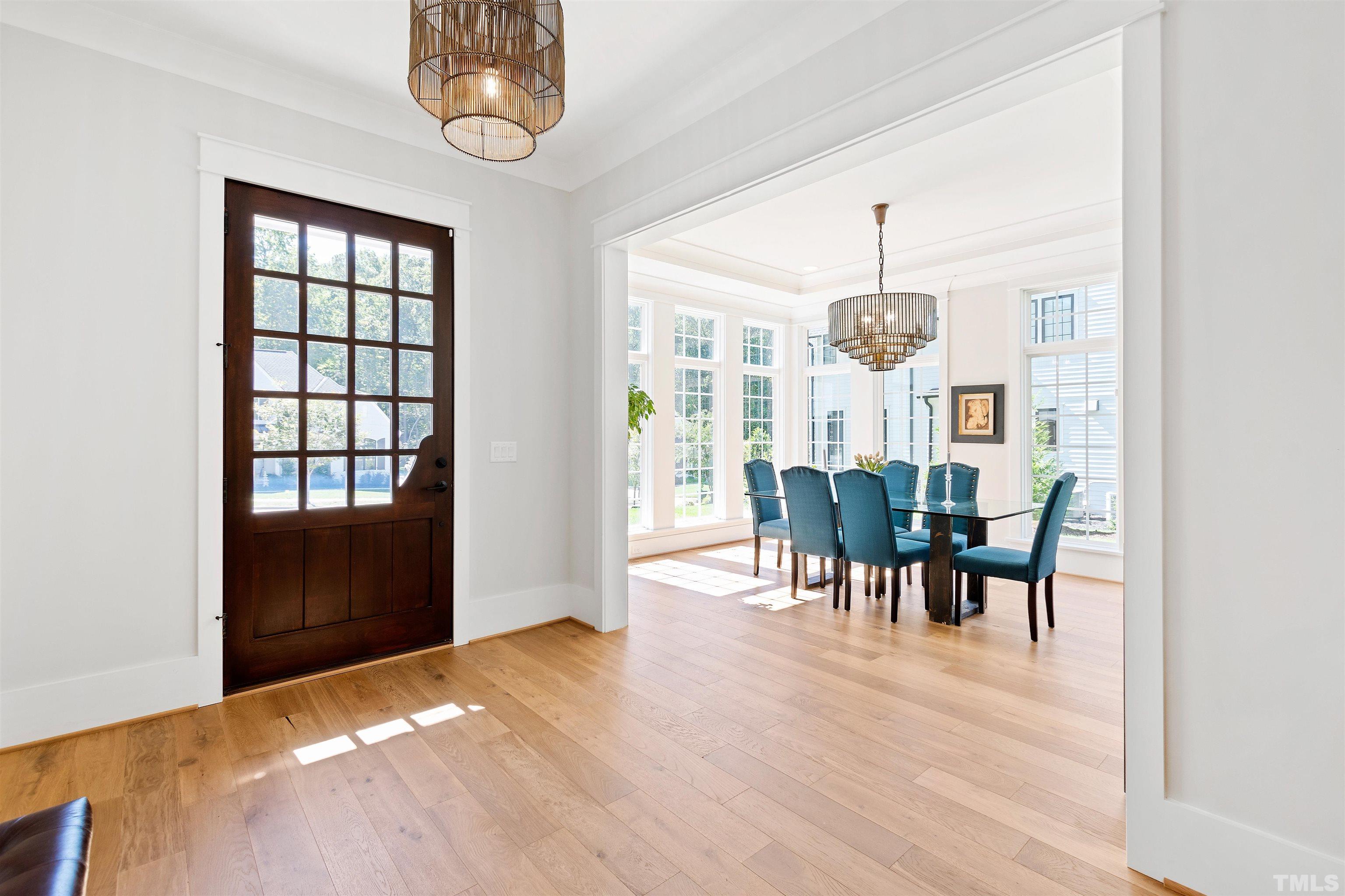 3512 Catalano Drive Raleigh, NC 27607 - Photo 10 of 64 a view of a dining room with furniture and chandelier