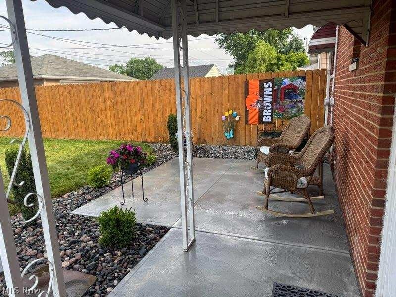 7287 Maplewood Road Parma, OH 44130 - Photo 32 of 35 Fenced rear yard covered patio