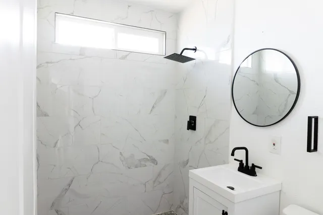 a bathroom with a sink and a mirror