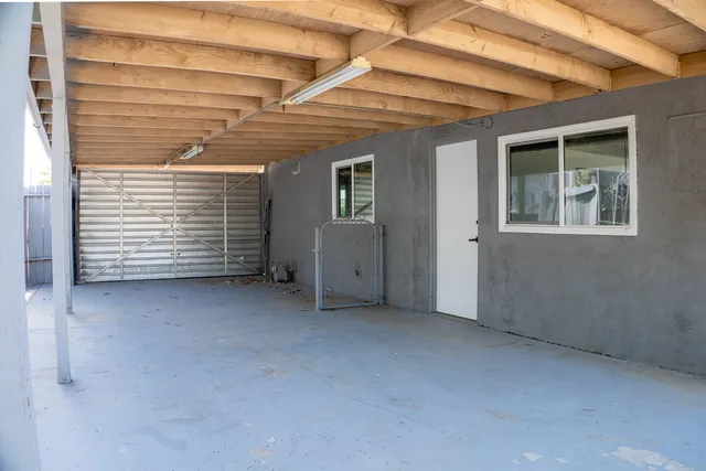 a view of an empty room with windows