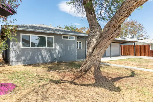 a view of a house with a snow in the yard
