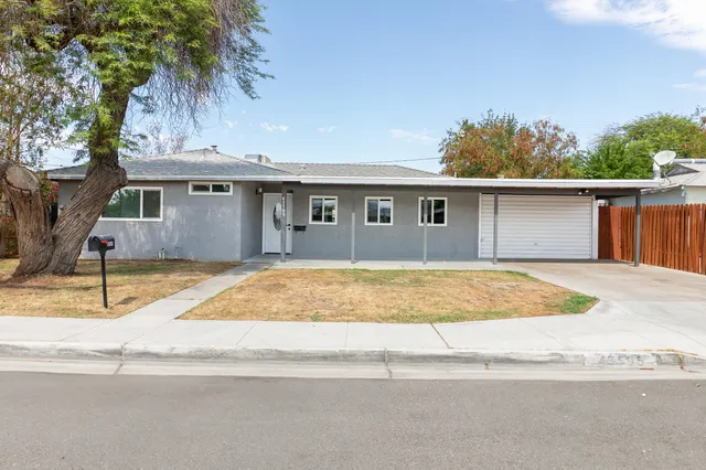 a house view with a backyard space