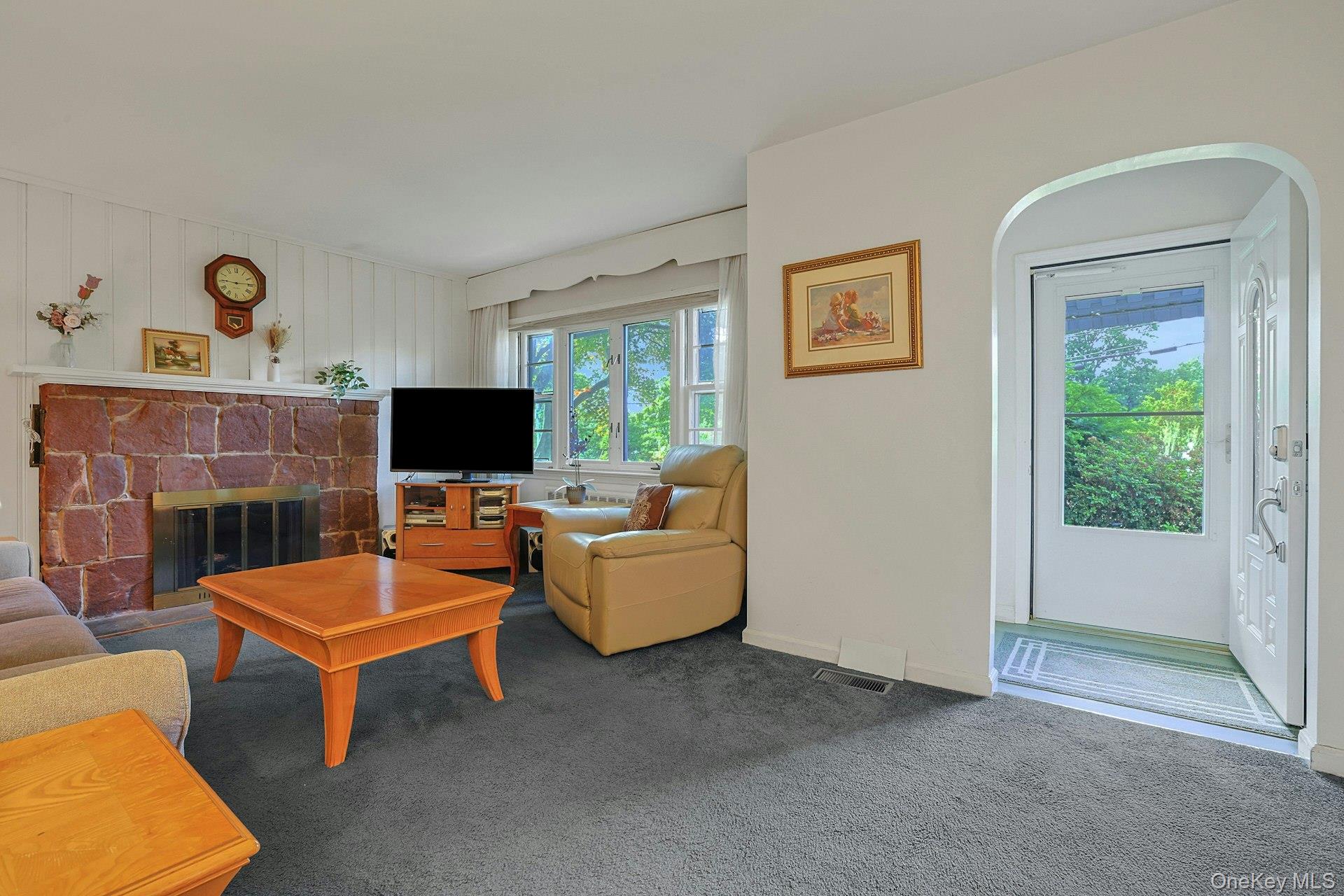 31 Townline Road Pearl River, NY 10965 - Photo 4 of 27 a living room with furniture and a flat screen tv