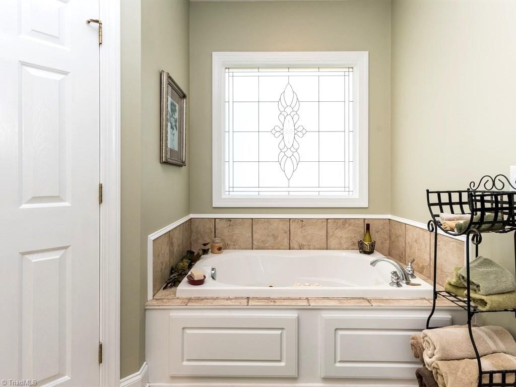 4202 Burch Bridge Road Burlington, NC 27217 - Photo 11 of 24 Jetted Tub in the Master as well as a Separate Tiled Shower