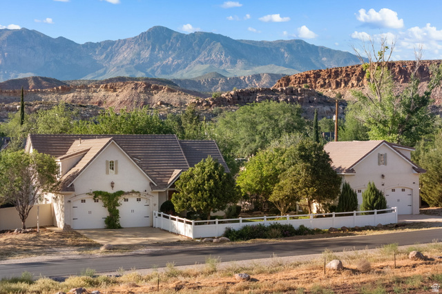20 Valley Road Leeds, UT 84746 - Photo 1 of 57 Stucco exterior residence featuring a tiled roof and integrated two-car garage