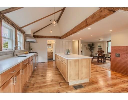 446 Liberty Square Road Boxborough, MA 01719 - Photo 20 of 29 a large white kitchen with a large counter top appliances and cabinets