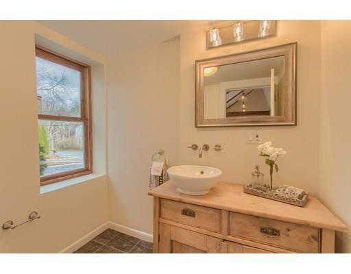 446 Liberty Square Road Boxborough, MA 01719 - Photo 26 of 29 a bathroom with a toilet sink vanity and mirror