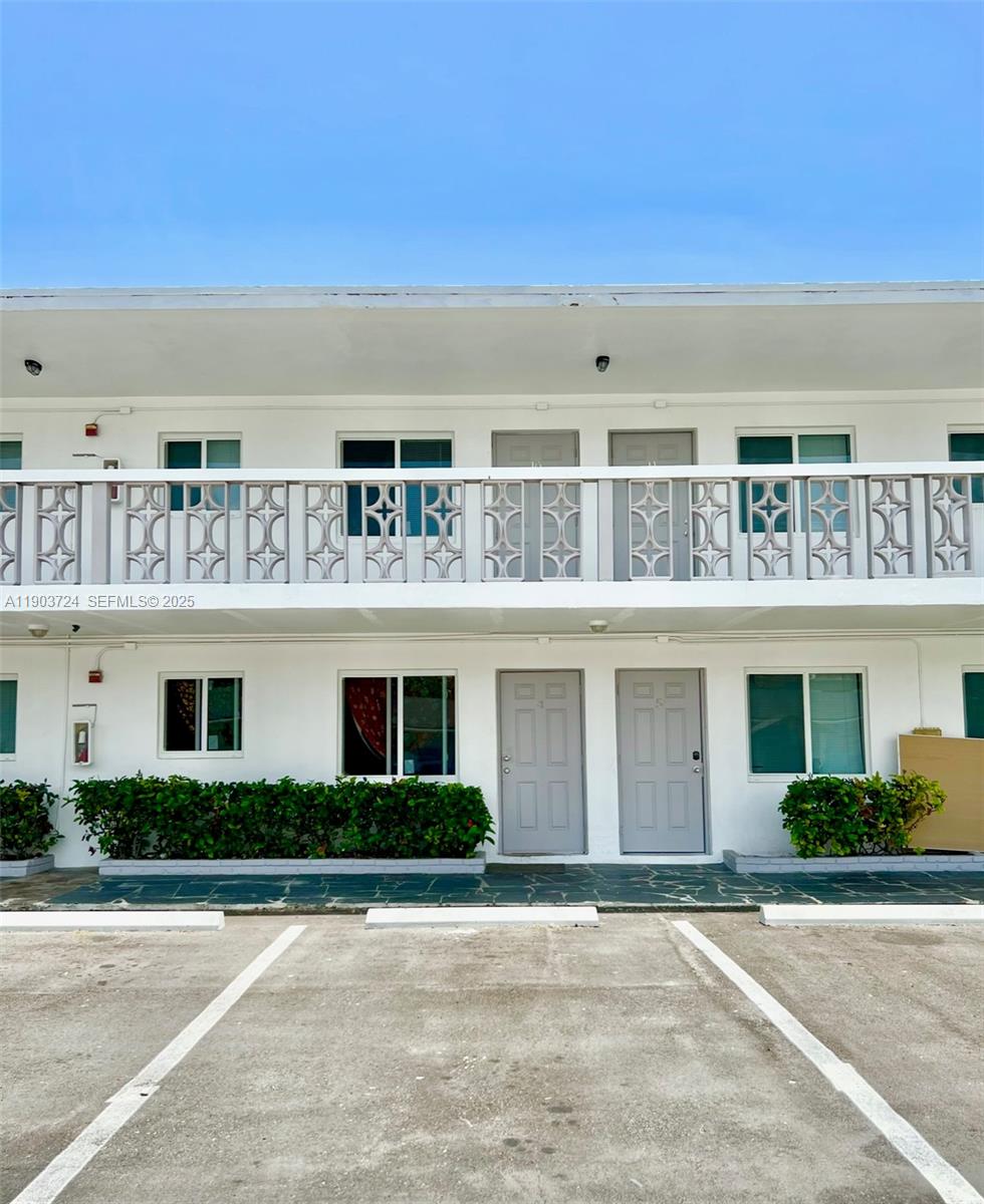 a front view of building with yard