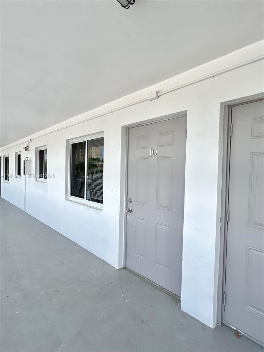 10 Northwest 77th Street, Unit 10 Miami, FL 33150 - Photo 3 of 12 an empty room with windows