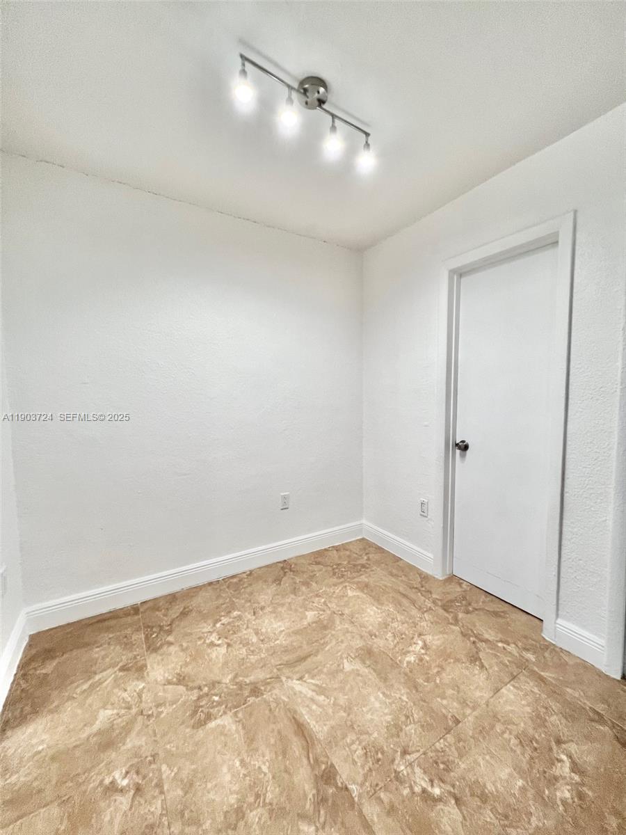 10 Northwest 77th Street, Unit 10 Miami, FL 33150 - Photo 8 of 12 a view of an empty room