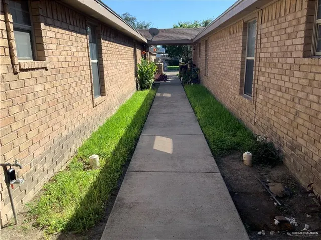 a view of a backyard with potted plants