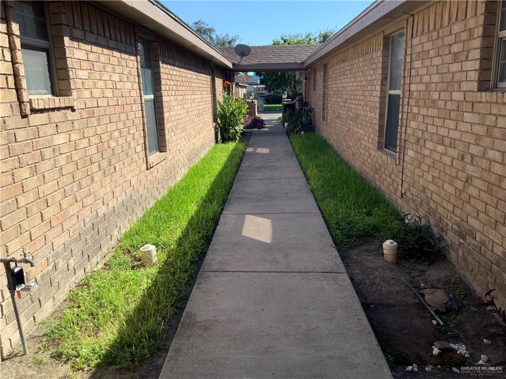 a view of a backyard with potted plants