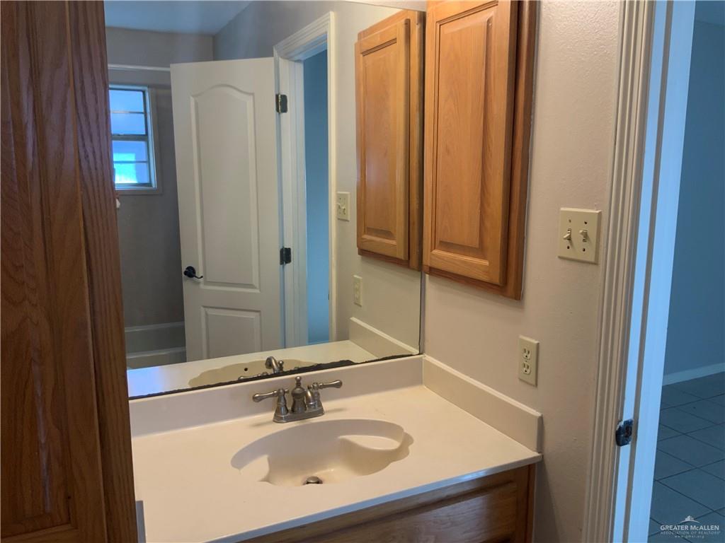 808 West Bronze Avenue, Unit B Pharr, TX 78577 - Photo 12 of 20 a bathroom with a sink and a mirror