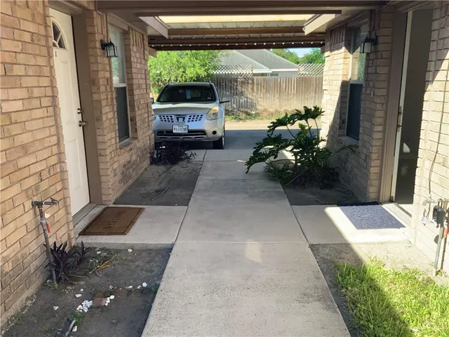 a backyard of a house with outdoor seating